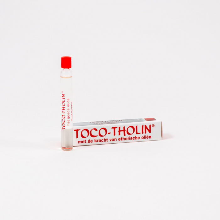Een buisje toco-tholin druppels voorde verpakking